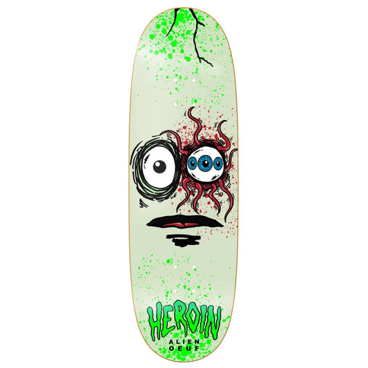 Skateboard deck with a face design and 'HERoin' branding on a white background