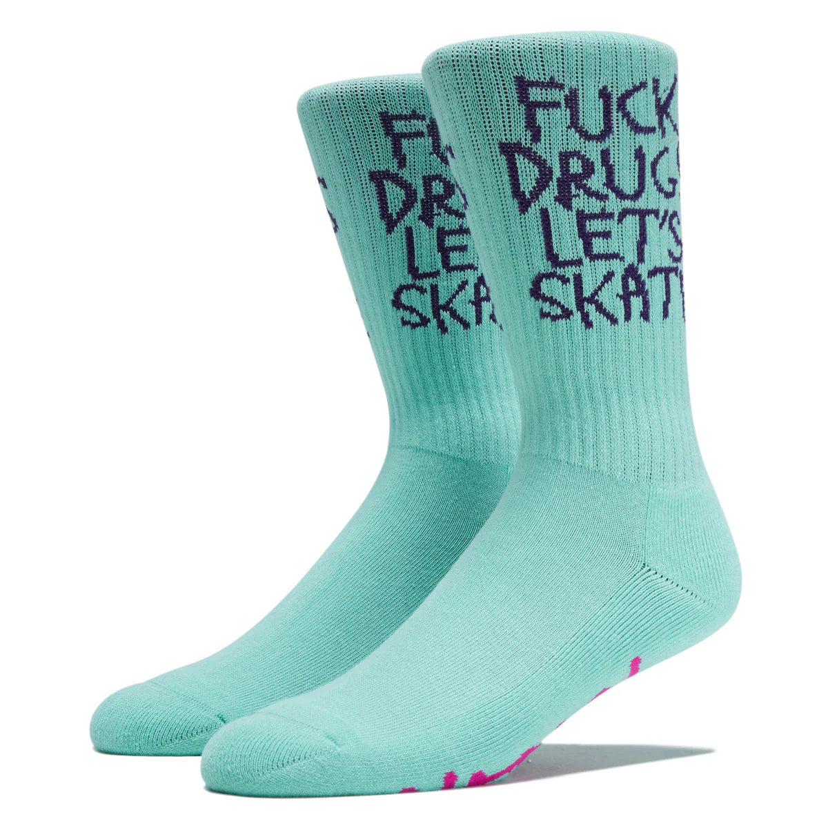 A pair of mint green crew socks with dark purple text reading 'FUCK DRUG LET'S SKATE' on the upper leg, shown on a white background.
