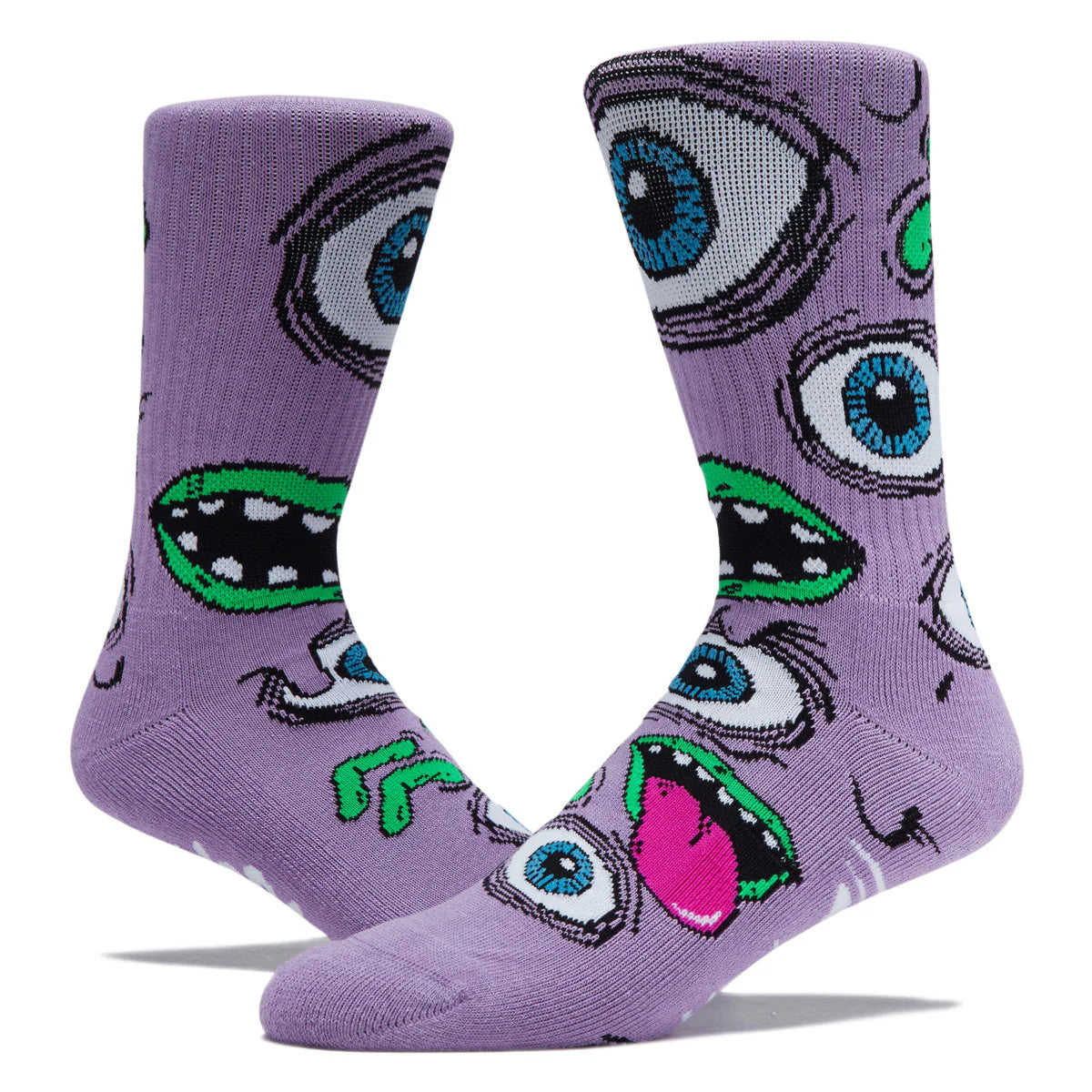 A pair of purple crew socks featuring a repeating cartoon monster eye and mouth pattern in black, blue, green, white, and pink, shown on a white background.