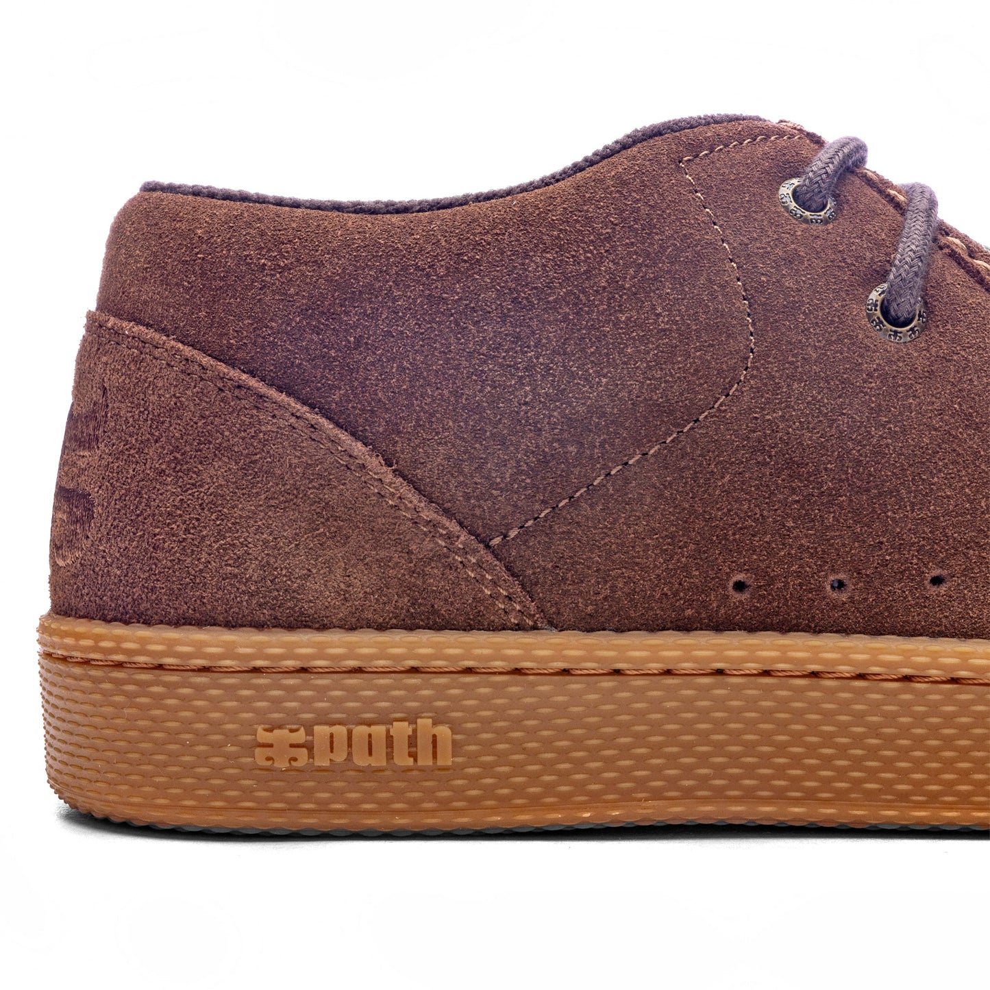 Brown suede shoe with tan sole on a white background