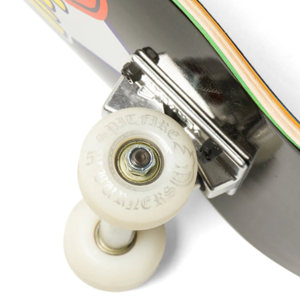 Close-up of a skateboard deck edge and front truck with off-white wheels, chrome hardware, and a multicolor graphic on a white background.