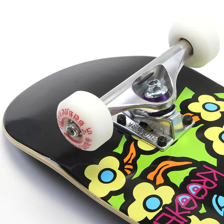 Skateboard with colorful floral design on a white background