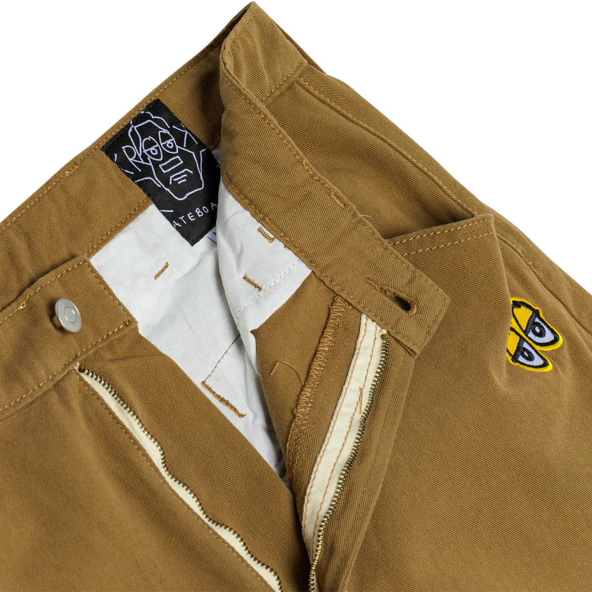 Close-up of a brown jacket with a brand label and logo on a white background