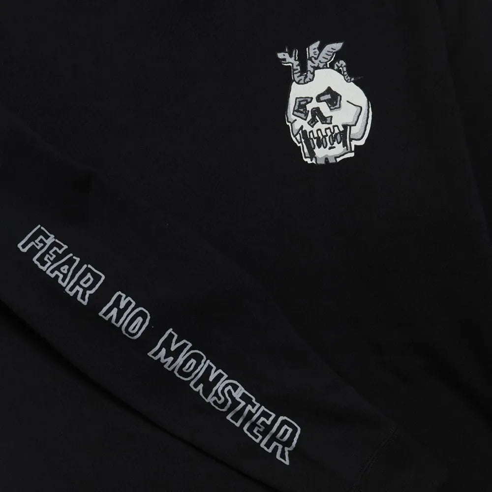 Black hoodie with white logo and 'Fear No Monster' text on a dark background