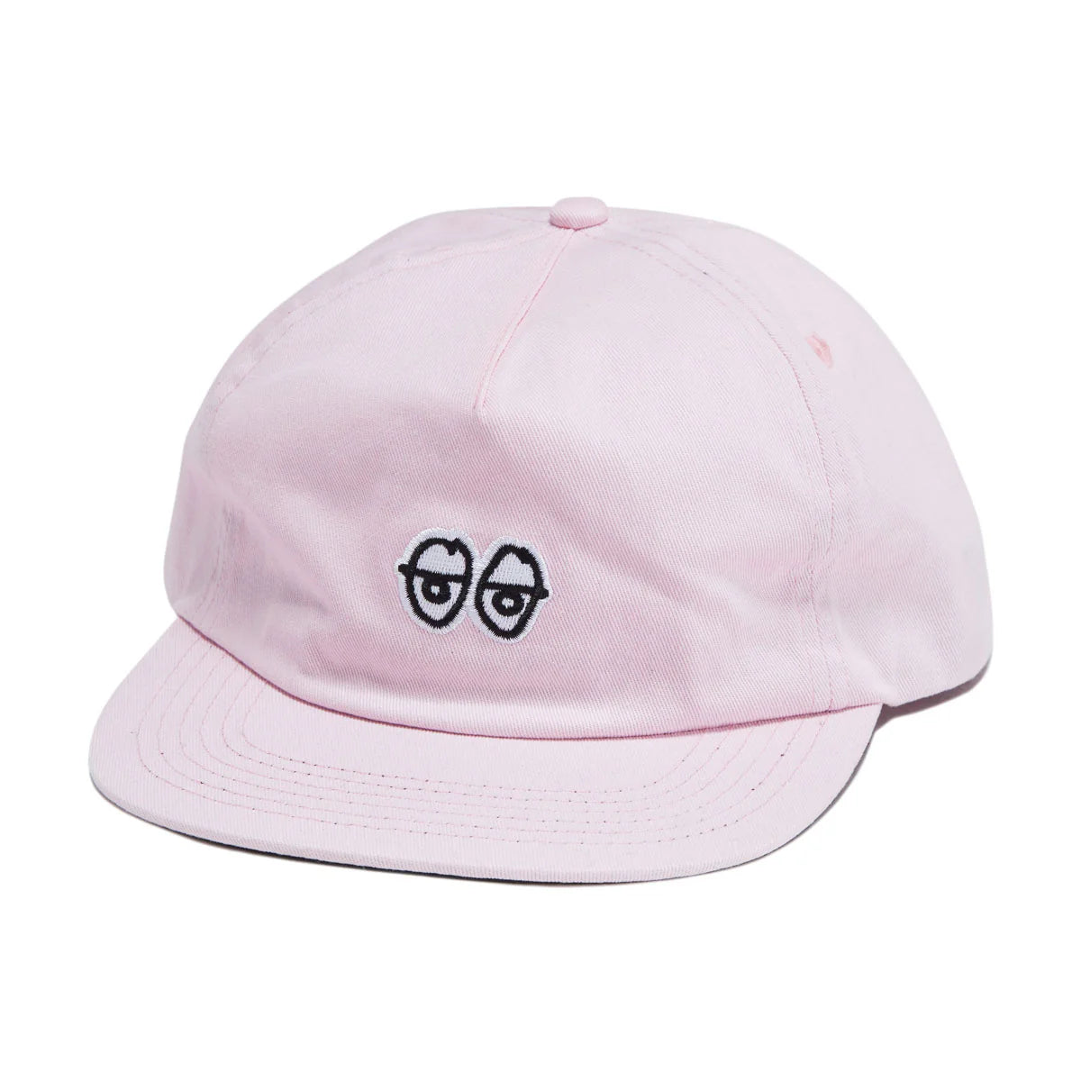 Pink cap with a unique design on a white background