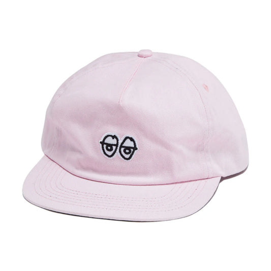 Pink cap with a unique design on a white background
