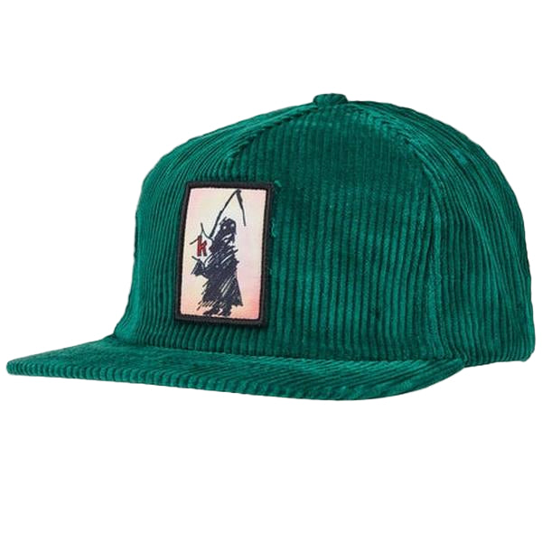 Green corduroy cap with a patch featuring a bear and fishing rod on a light gray background