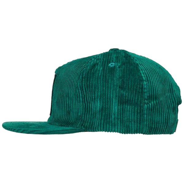 Green corduroy cap on a white background