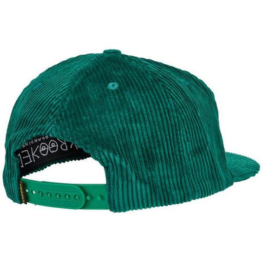 Green corduroy cap with a brand logo on a white background