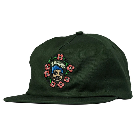 Green cap with embroidered design on a white background