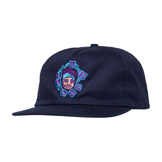Navy blue cap with colorful embroidered design on a white background