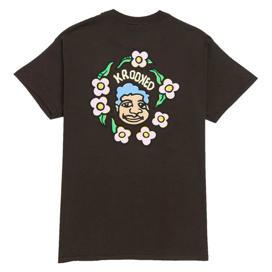 brown t-shirt with a colorful graphic on the back featuring a face and flowers, with 'Krooked' branding.