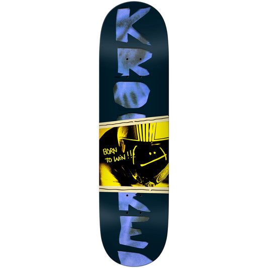 A skateboard deck shown vertically against a plain white background. The deck has a dark navy blue base with large light blue 'KROOKED' lettering at the top and bottom, a yellow graphic band across the center, and a black illustration with yellow text reading 'BORN TO WIN!!'.