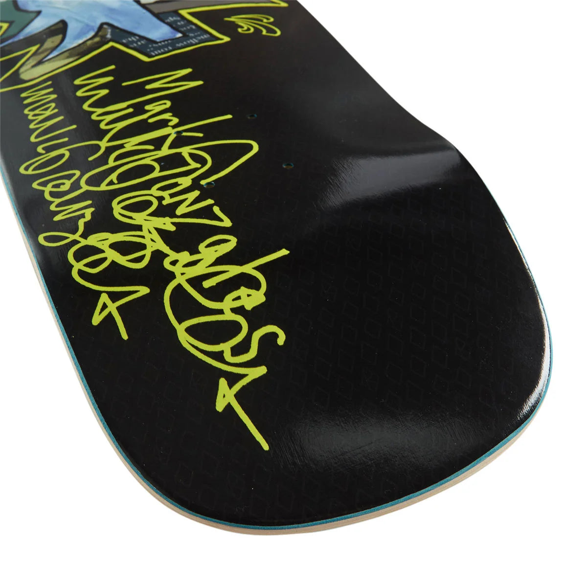 Close-up of a skateboard deck with a glossy black base, bright yellow script graphics, and a small blue graphic in the upper corner, photographed on a white background.
