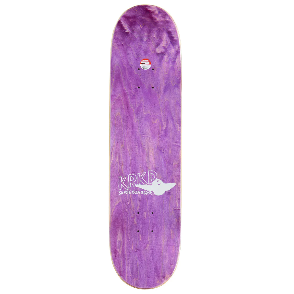 A purple skateboard deck with a natural wood grain pattern, featuring a white graphic of a winged wheel and the text 'KRKD SKATE BOARDS' in the center, and a small sticker near the nose.