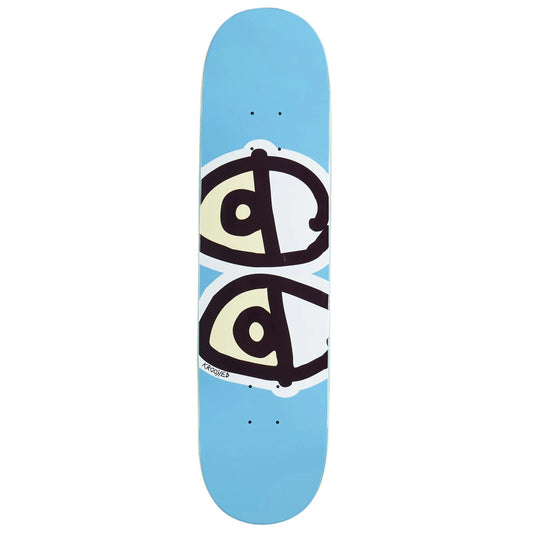 A light blue skateboard deck featuring a graphic of two stylized cartoon eyes in black, white, and pale yellow, with the brand name 'krooked' printed near the bottom.