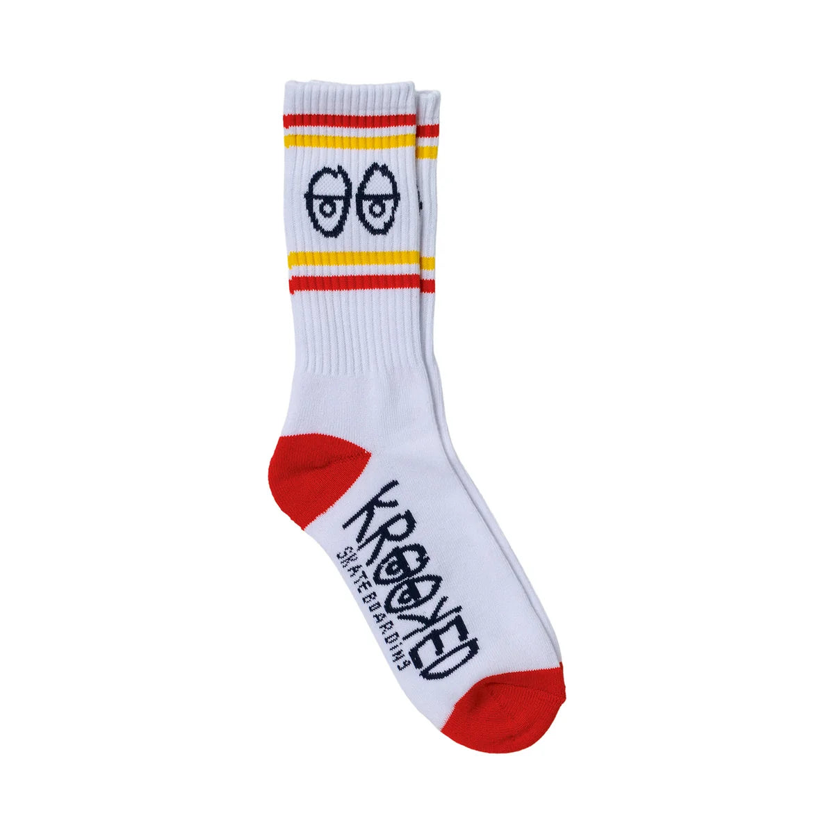A pair of white crew socks with red and yellow stripes near the cuff, a black cartoon face graphic, and 'KROOKED skateboards' printed in black on the sole, shown against a plain white background.