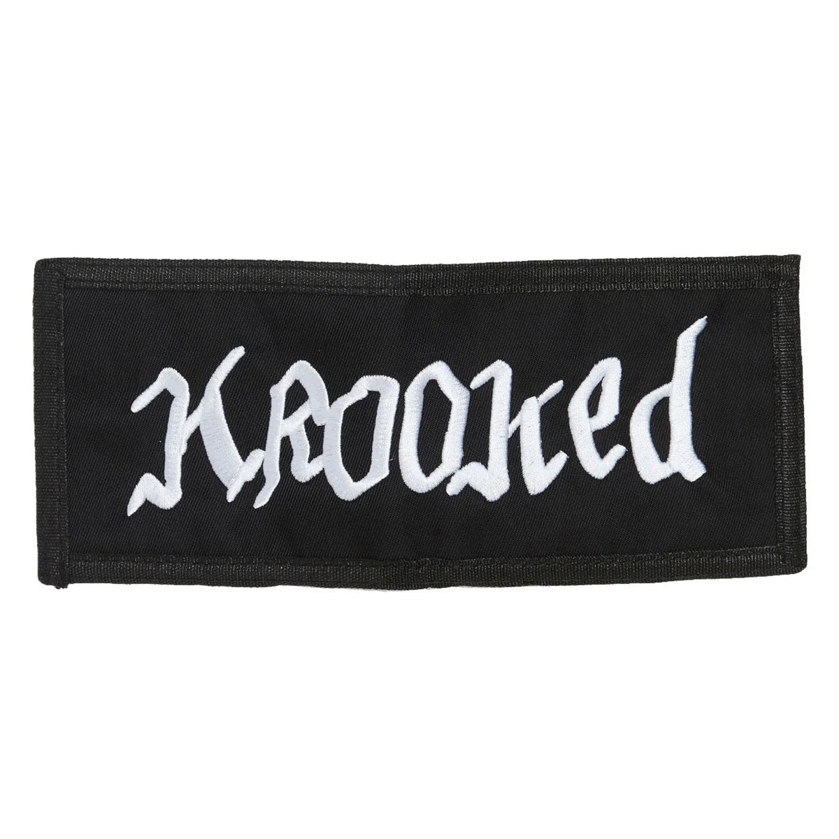 A rectangular black fabric patch with the word 'krooked' embroidered in a stylized white gothic font, shown on a plain white background.