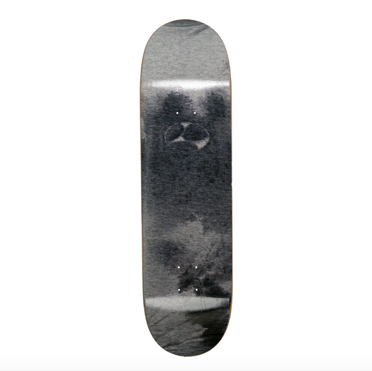 Skateboard deck with a black and white abstract design on a white background