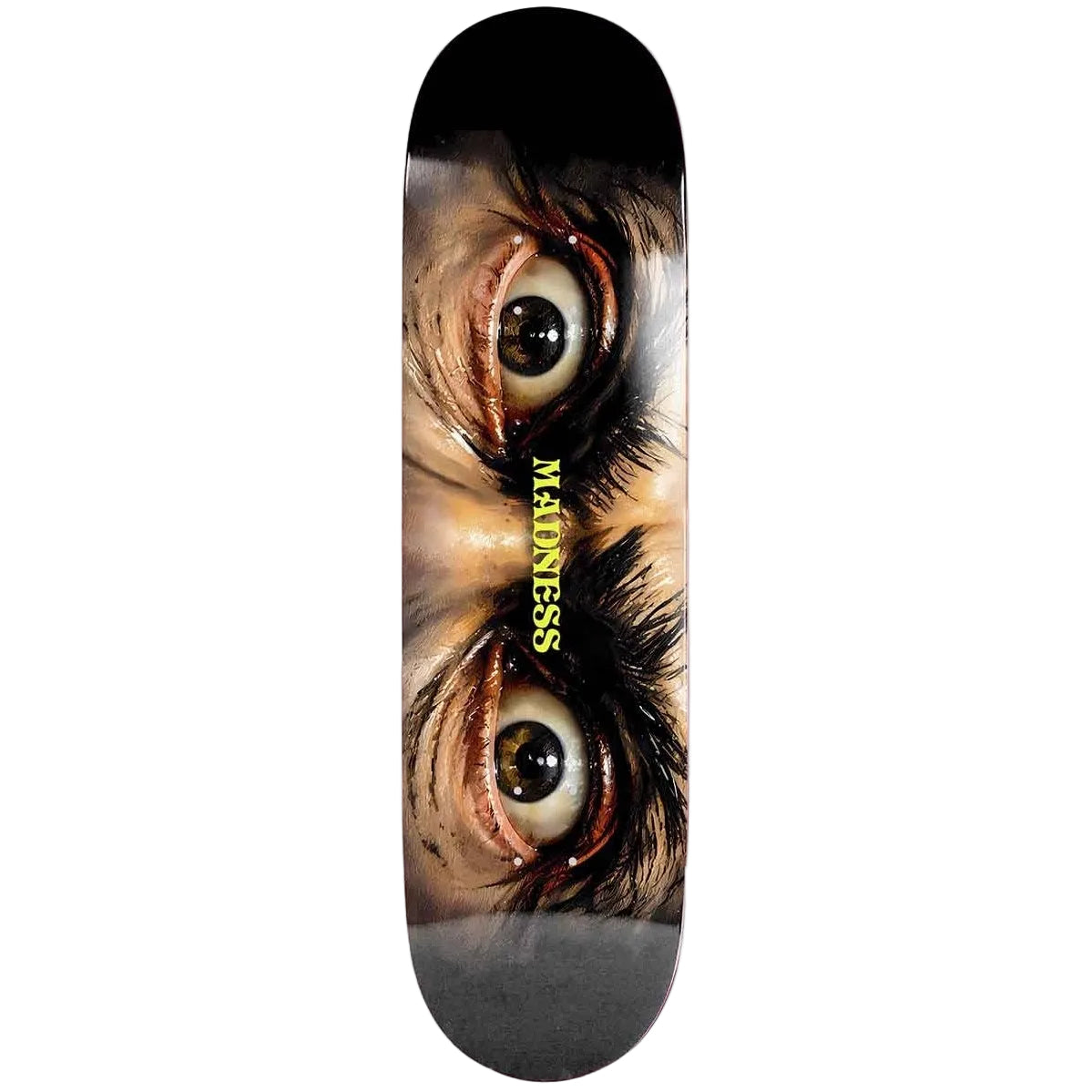 A skateboard deck featuring a graphic print of a close-up face with intense eyes and the word 'MAdNESS' printed vertically in yellow.