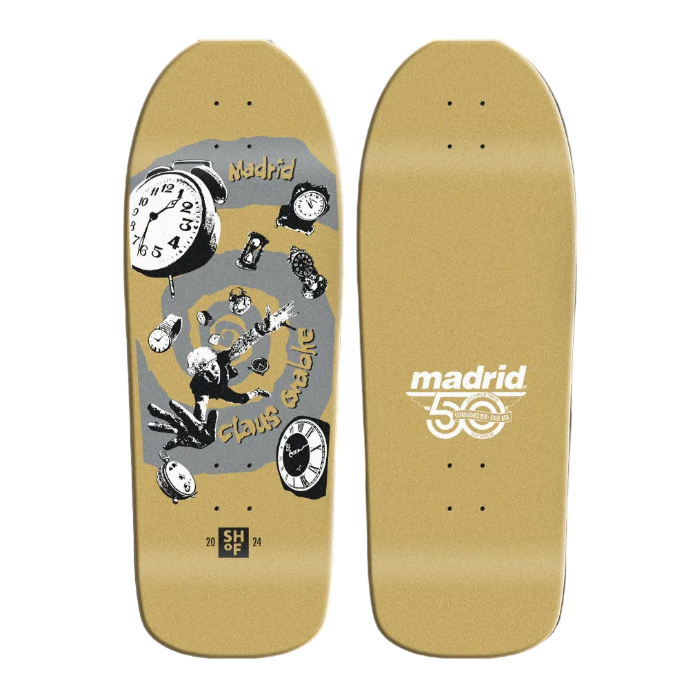Skateboard deck with graphic design and 'Madrid' branding on a beige background