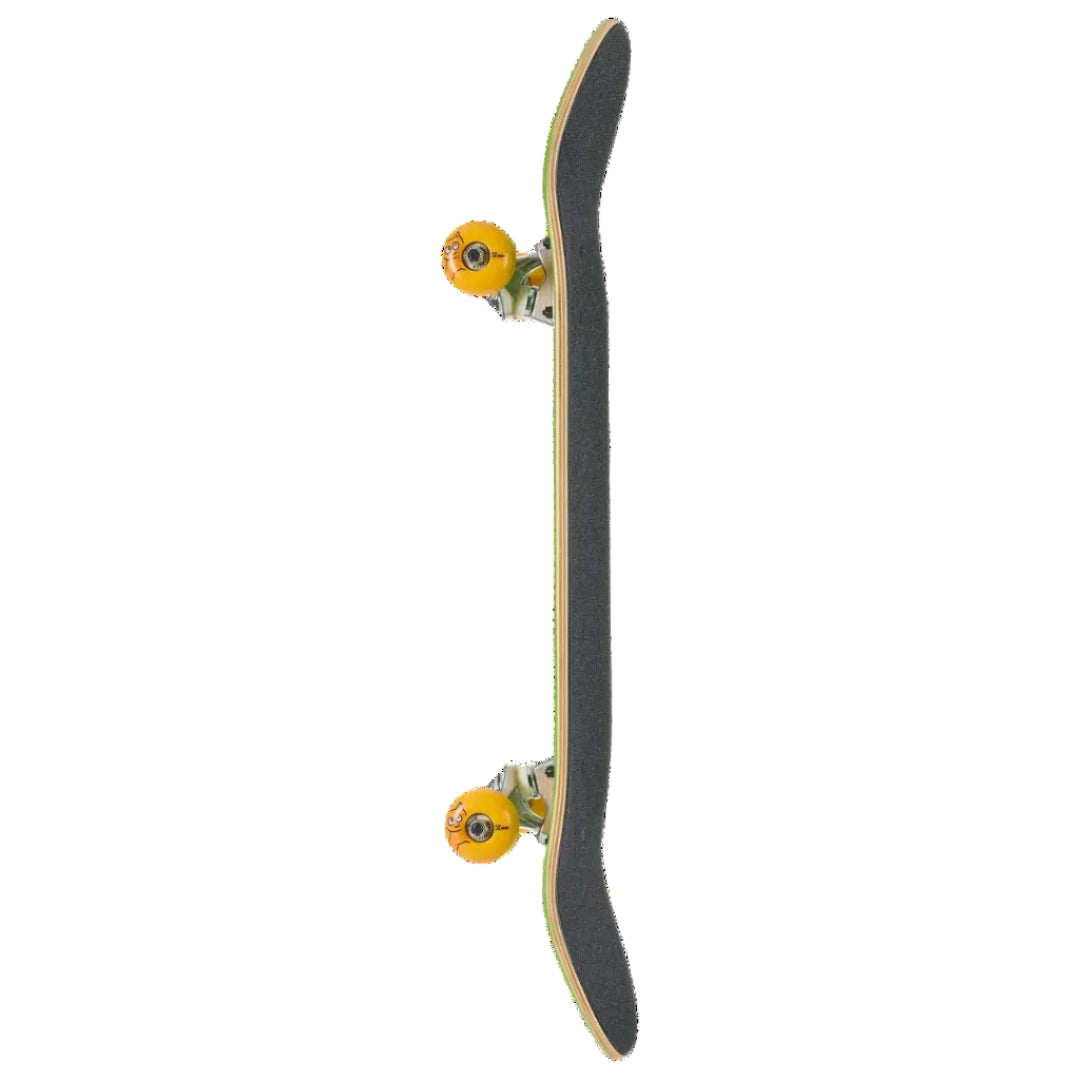 A skateboard shown vertically from the side against a plain white background, featuring a black grip tape deck, natural wood edges, green trucks, and bright orange wheels.