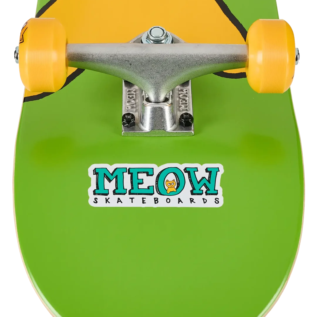 Close-up of a skateboard deck with a bright green base, yellow cartoon character graphic, and a Meow Skateboards sticker on the underside, with yellow wheels and a silver truck visible.