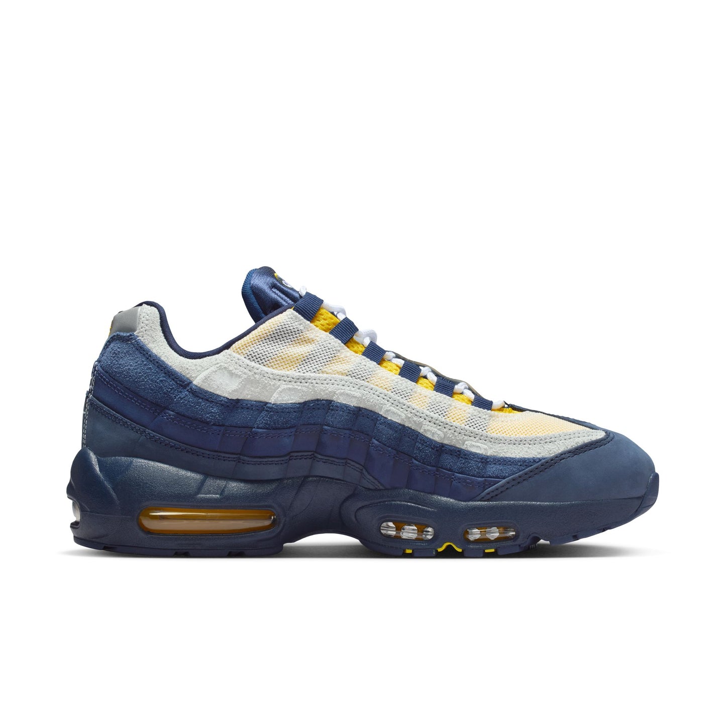 Blue and white sneaker with yellow accents on a white background