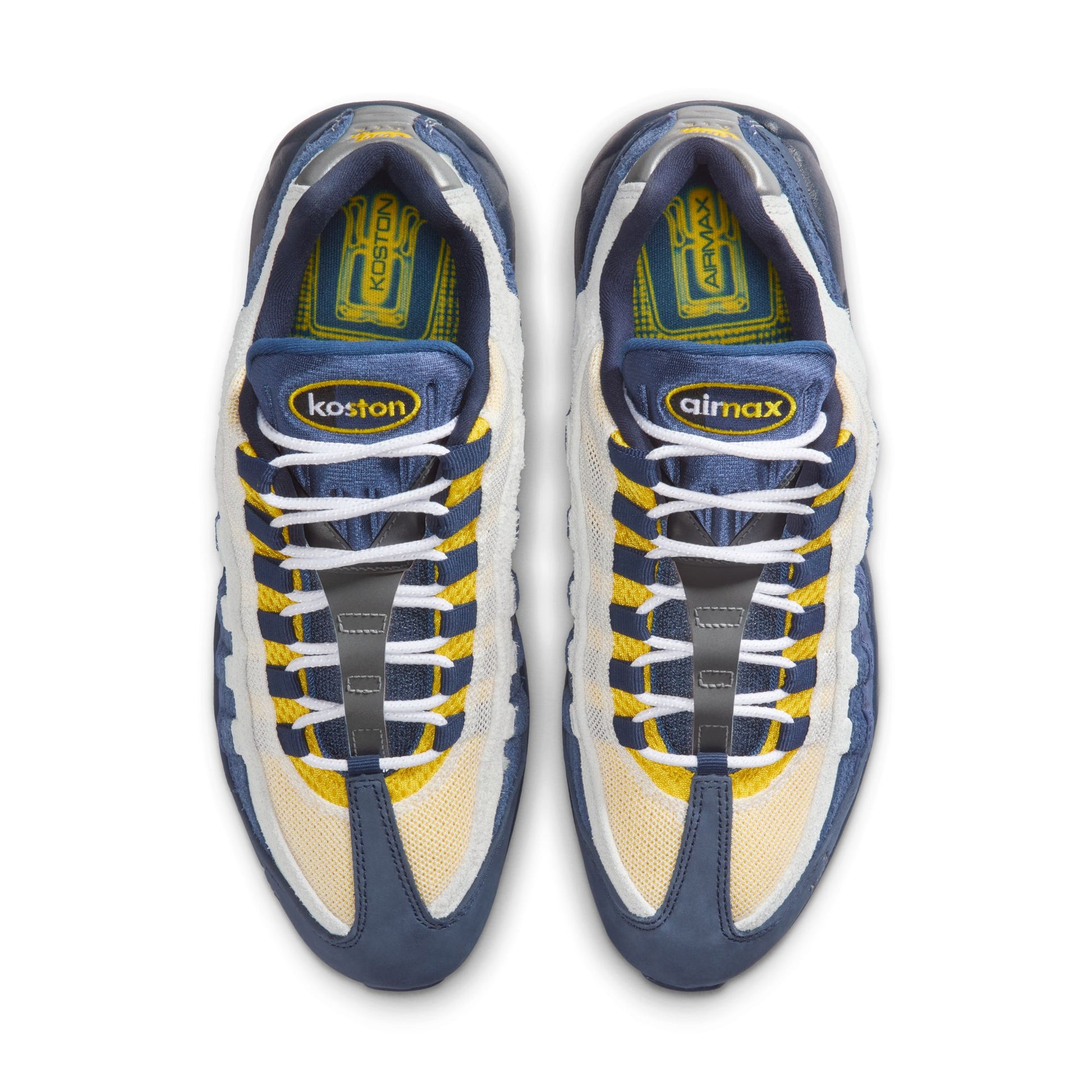 Pair of blue and yellow sneakers with visible branding on a white background