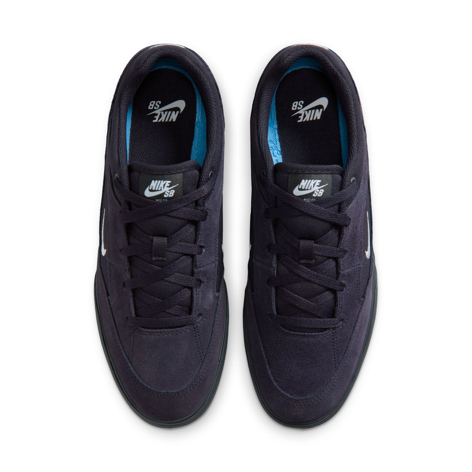 Pair of navy blue Nike sneakers on a white background