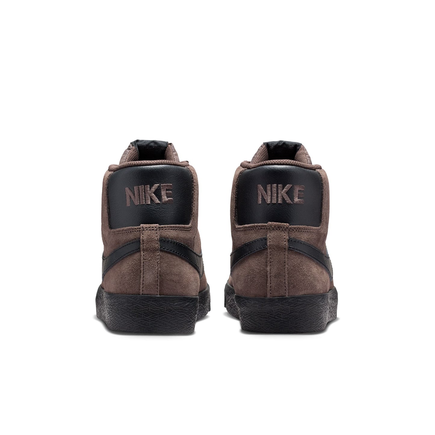 Brown Nike sneakers with black soles on a white background