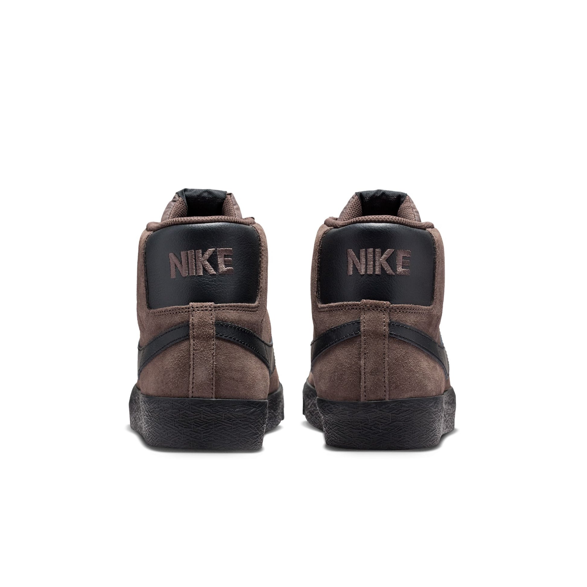 Brown Nike sneakers with black soles on a white background
