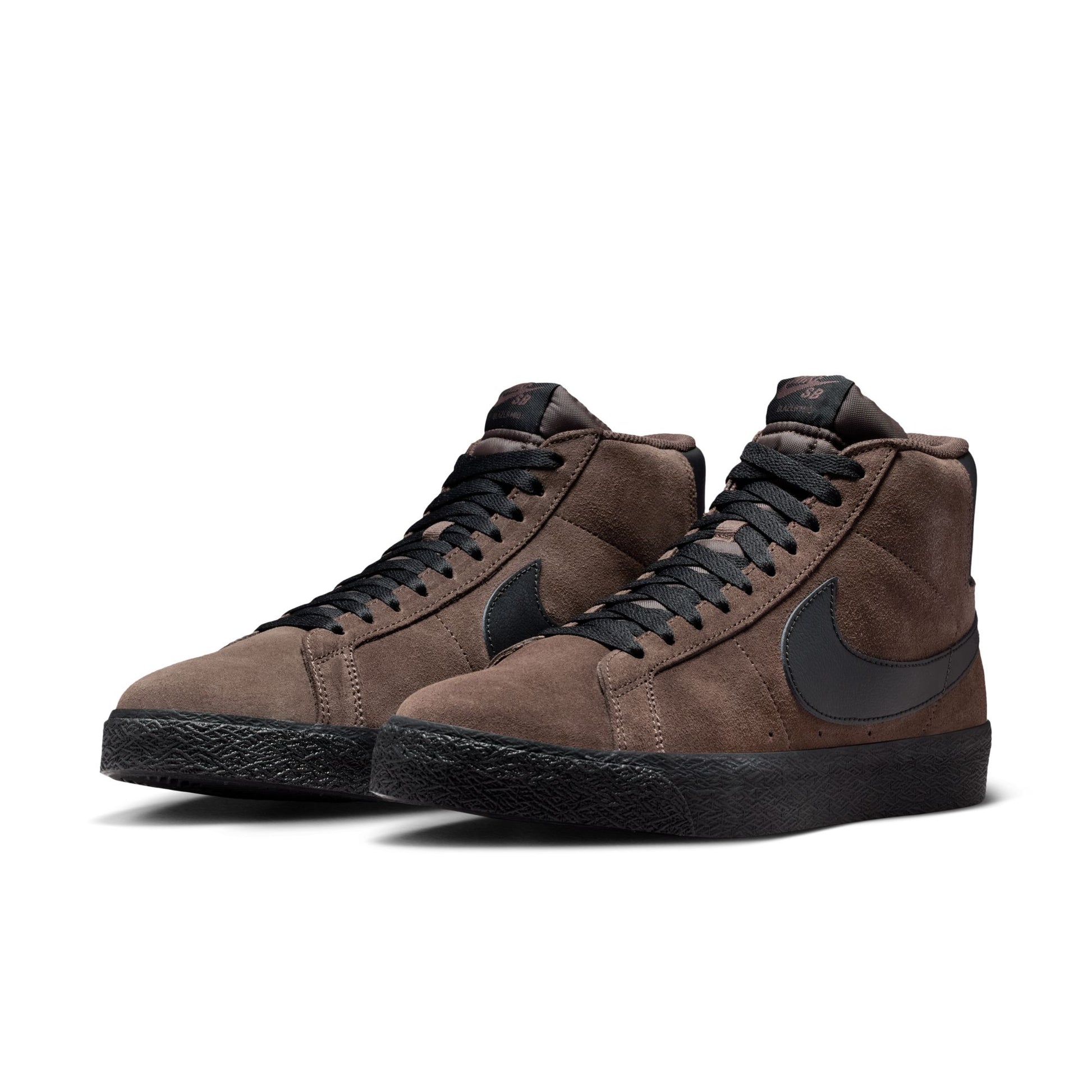 Brown high-top sneakers with black swoosh logo on a white background