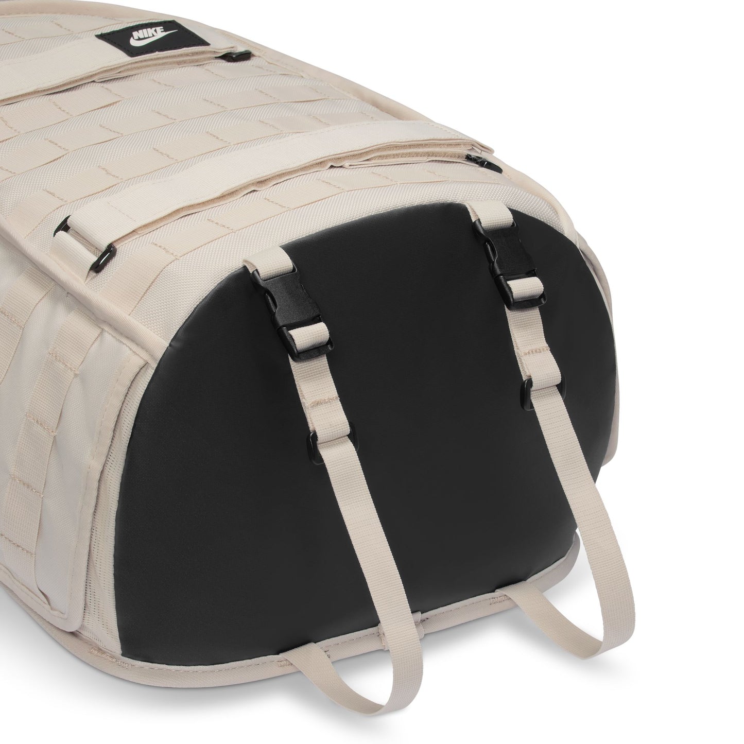 Beige and black duffel bag with Nike logo on a white background