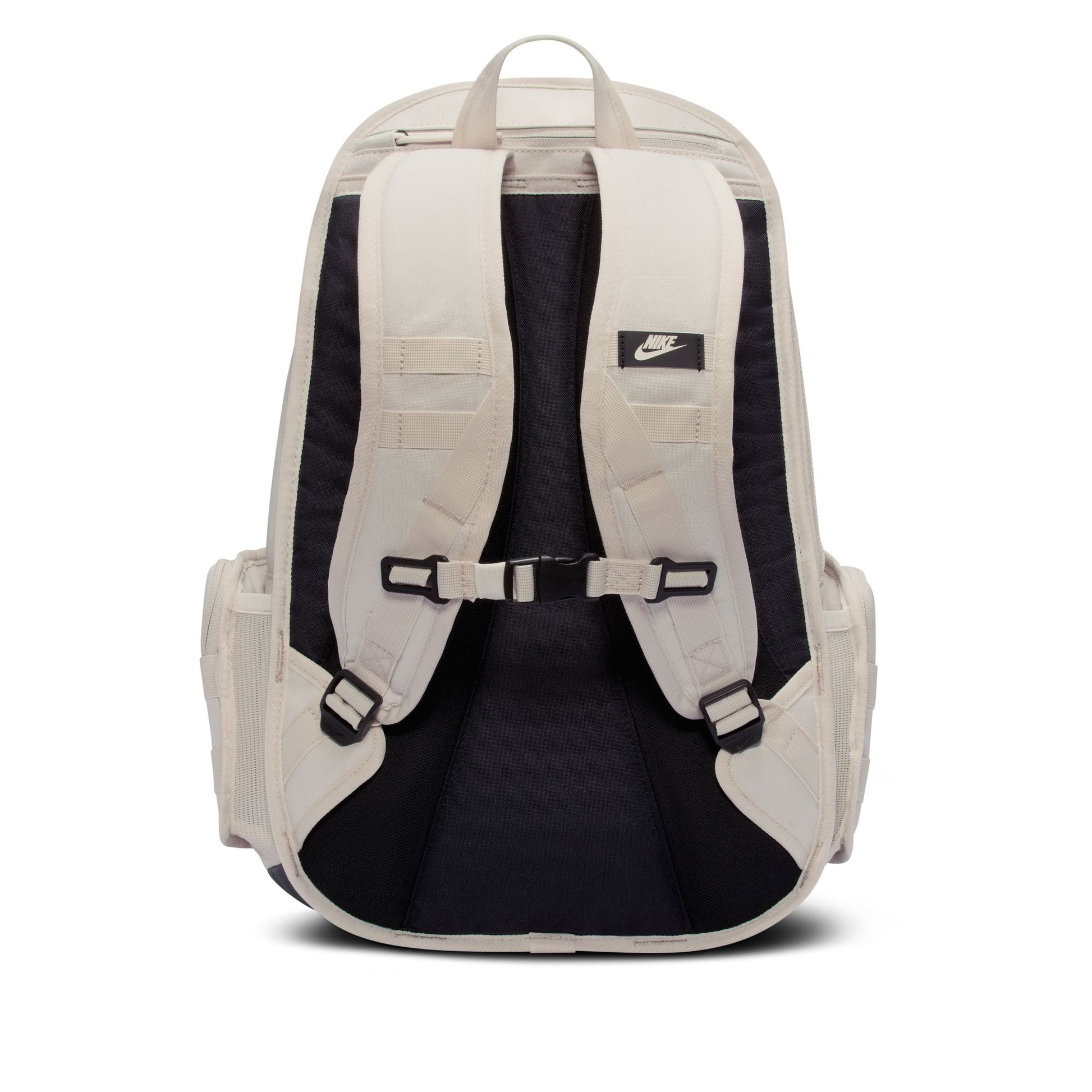 Beige backpack with black interior and visible Nike logo on a white background