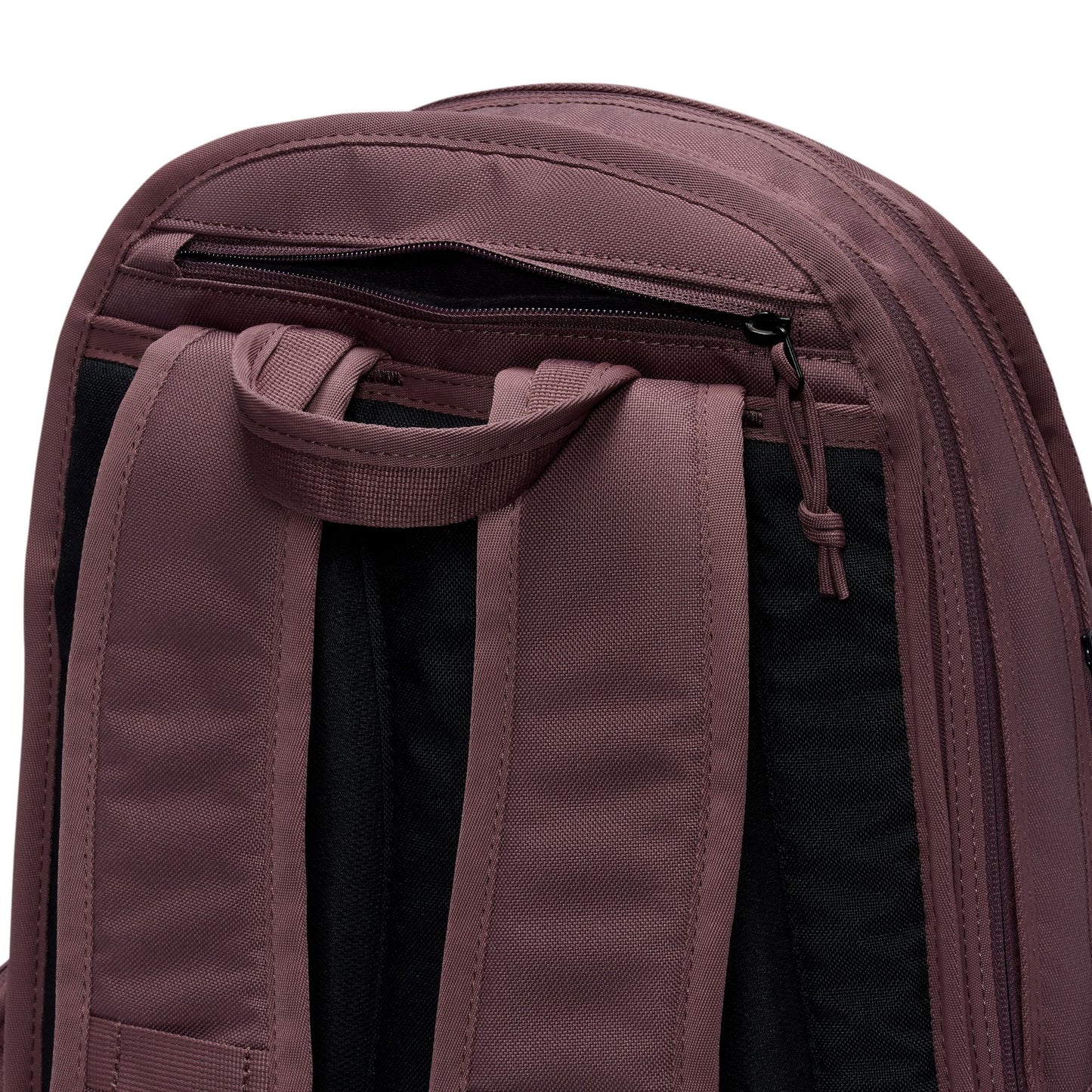 Close-up of a maroon backpack with straps and zippers on a white background