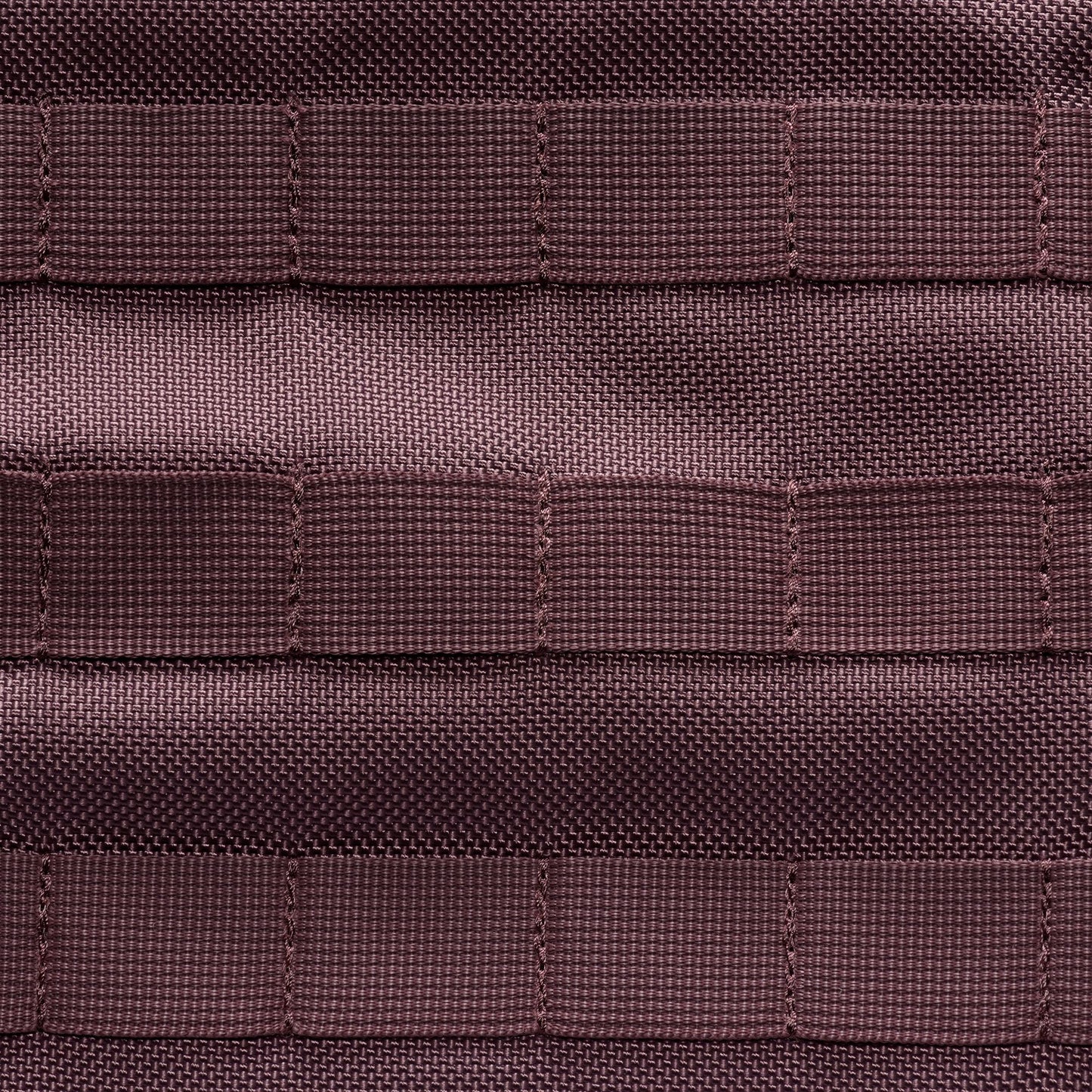 Close-up of brown textured fabric with a grid pattern
