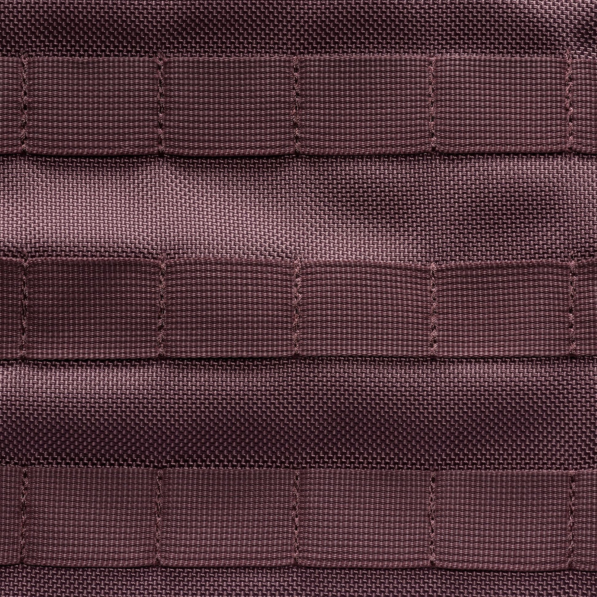 Close-up of brown textured fabric with a grid pattern