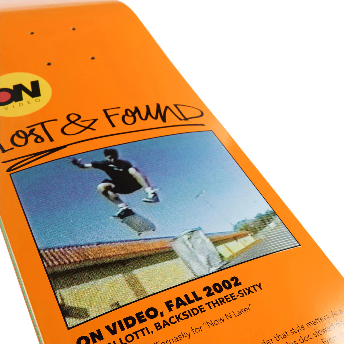 Orange skateboard deck with 'Lost & Found' and 'ON Video' branding, featuring a skateboarder in mid-air.