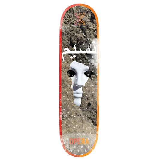 Skateboard deck with a design of a dog peeking out from dirt on a white background