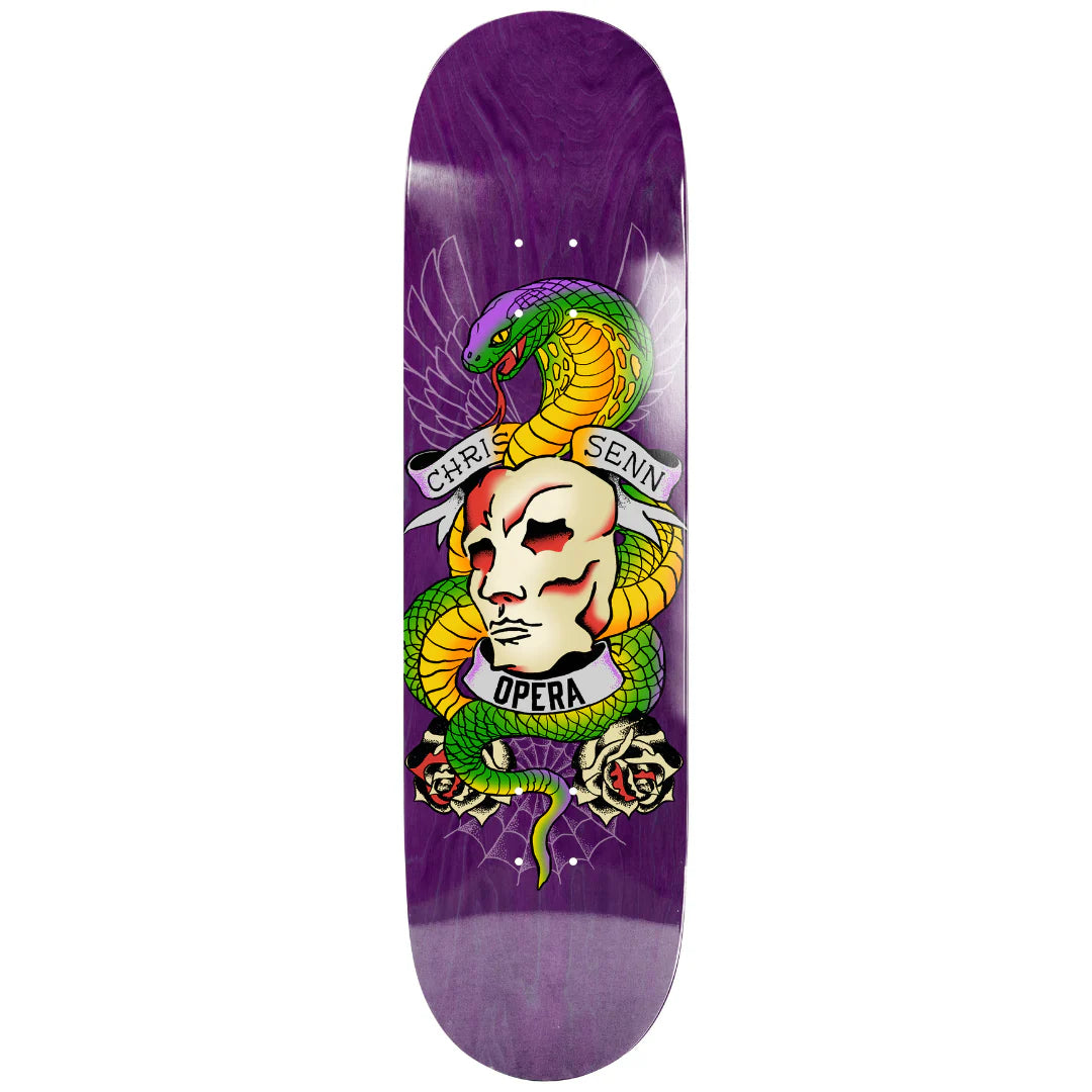 Skateboard deck with colorful design featuring a face and snakes on a purple background
