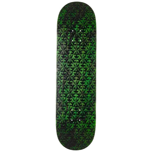 Skateboard deck with green and black pattern on a white background