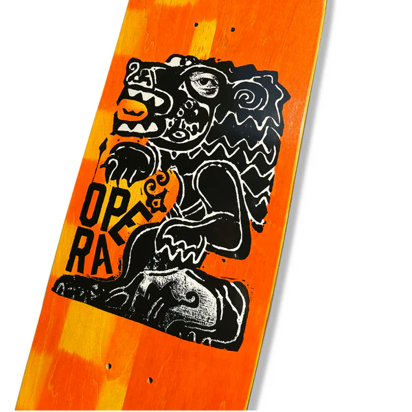Skateboard deck with a black lion graphic and 'Opera' text on an orange and yellow checkered background