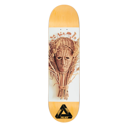Skateboard deck with wicker head design and Palace logo on a white background