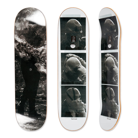 Three skateboard decks with black and white images of a person underwater.