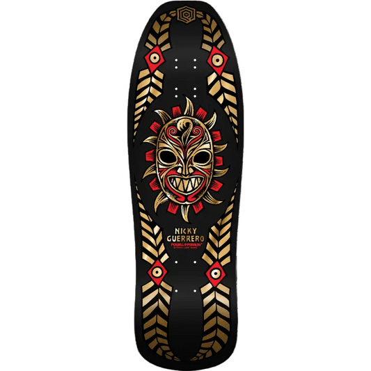 Skateboard deck with a tribal mask design on a black background