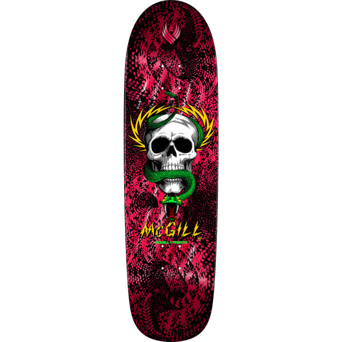 Skateboard deck with a skull and snake design on a red and black background