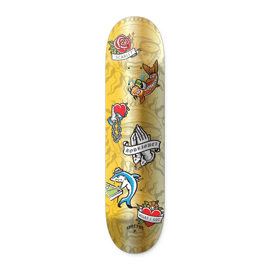 Skateboard deck with tattoo-style graphics on a yellow background