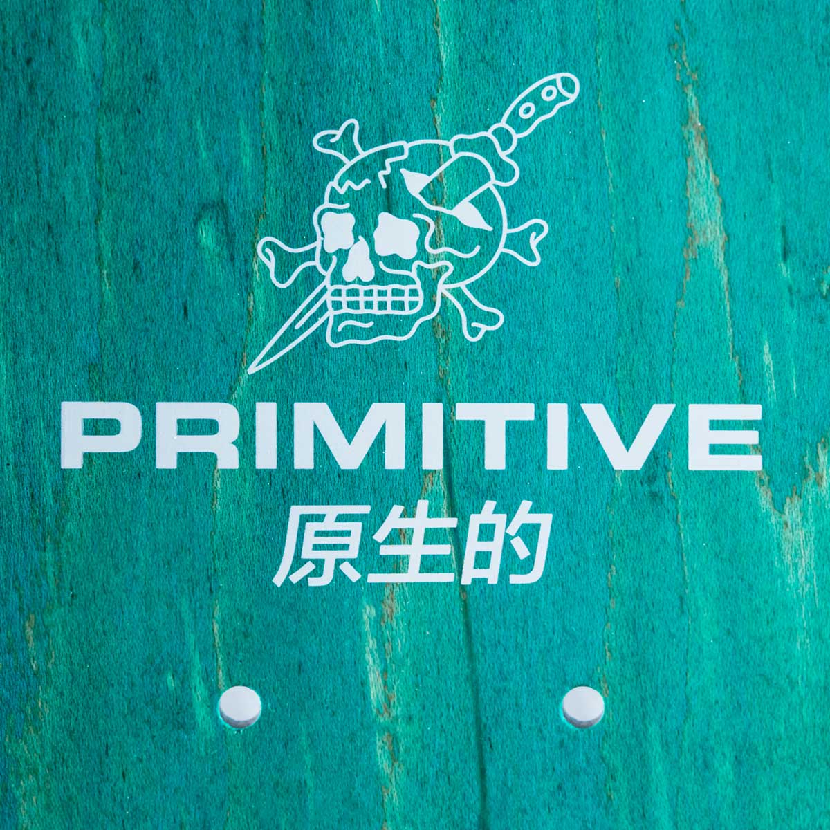 A turquoise painted wood background with a white line-art skull and crossbones logo above the word PRIMITIVE and Chinese characters, plus two small white oval marks near the bottom.