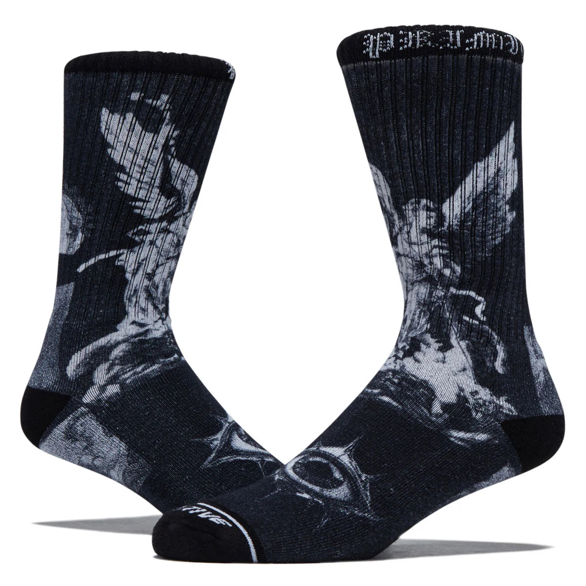A pair of crew socks in black and gray featuring a graphic print of a winged angel, with the brand name 'Stance' visible on the toe and cuff.